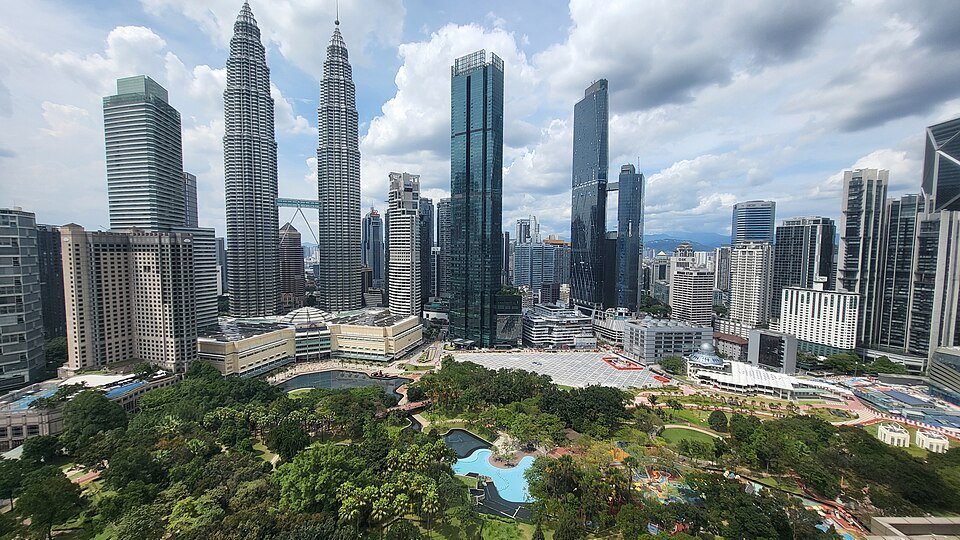 KLCC Park lake and gardens beneath the skyline
